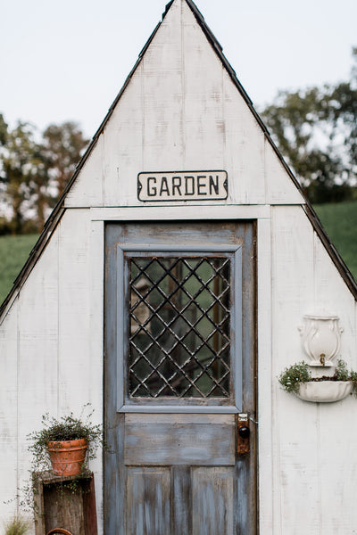 The Garden Sign In The Flower Garden